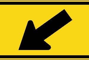 Panonceau de localisation d'un passage flèche oblique à gauche (posé à droite de la route)